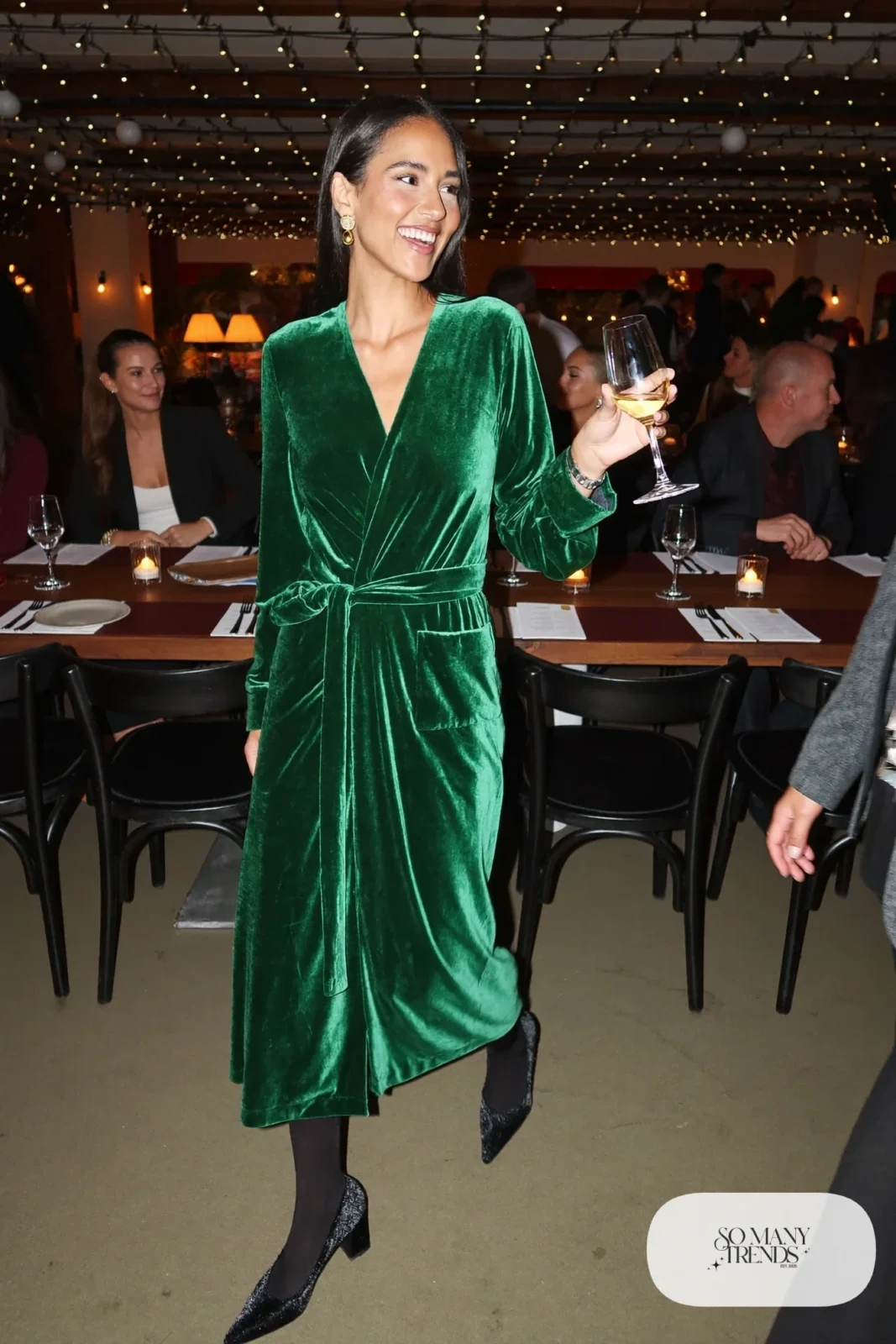 emerald green velvet wrap midi dress black tights block heels gold earrings outfit 23