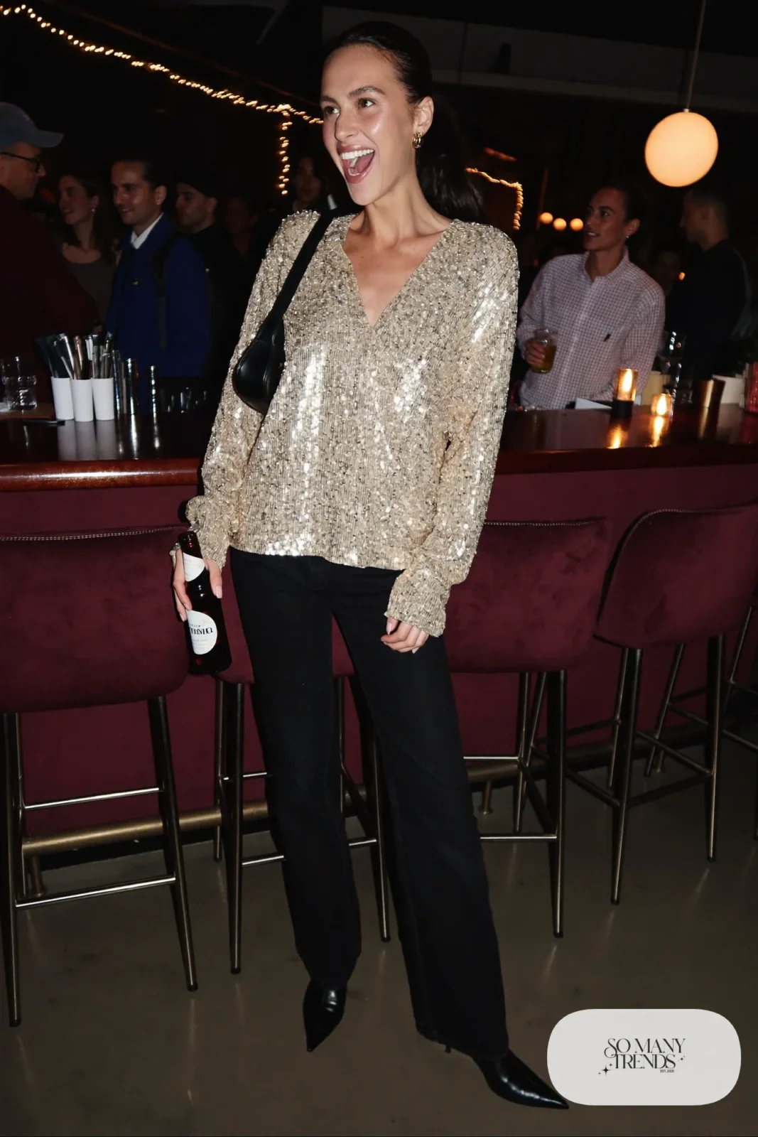 gold sequin long-sleeve top black straight jeans black pointed ankle boots outfit 25