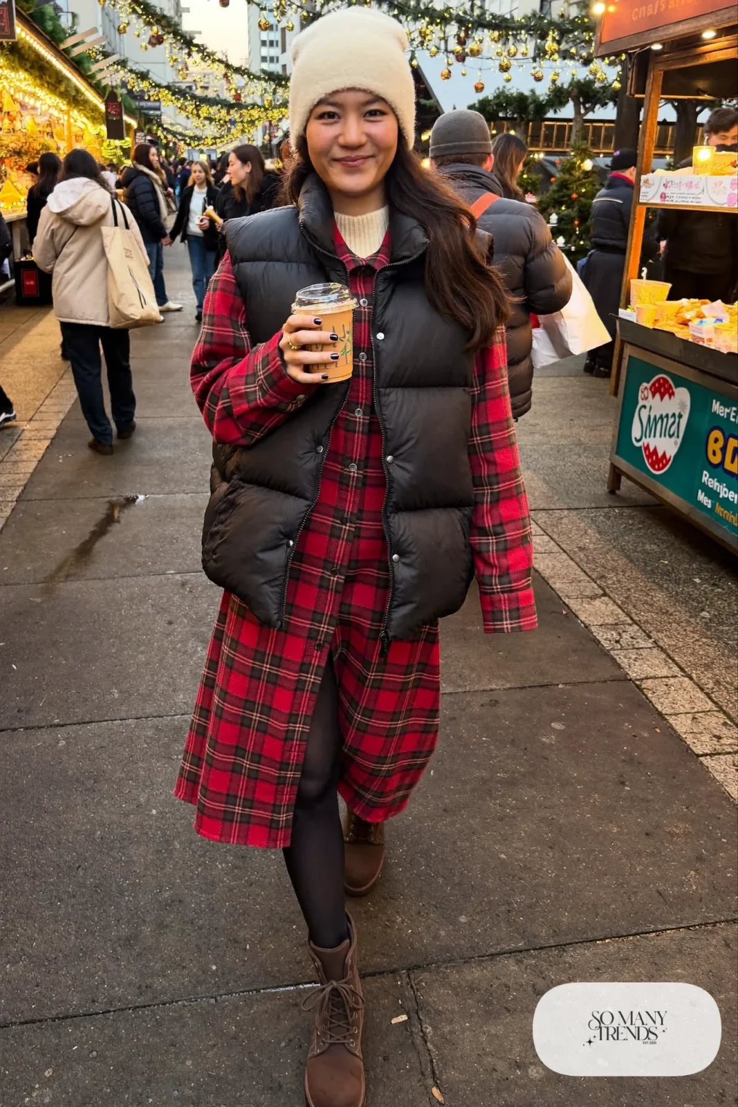 red plaid flannel shirt dress black puffer vest fleece-lined tights lace-up boots christmas market outfit 9