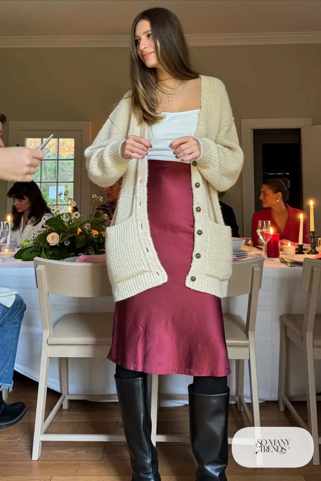burgundy satin midi skirt cream chunky cardigan black tall boots gold necklaces outfit 8