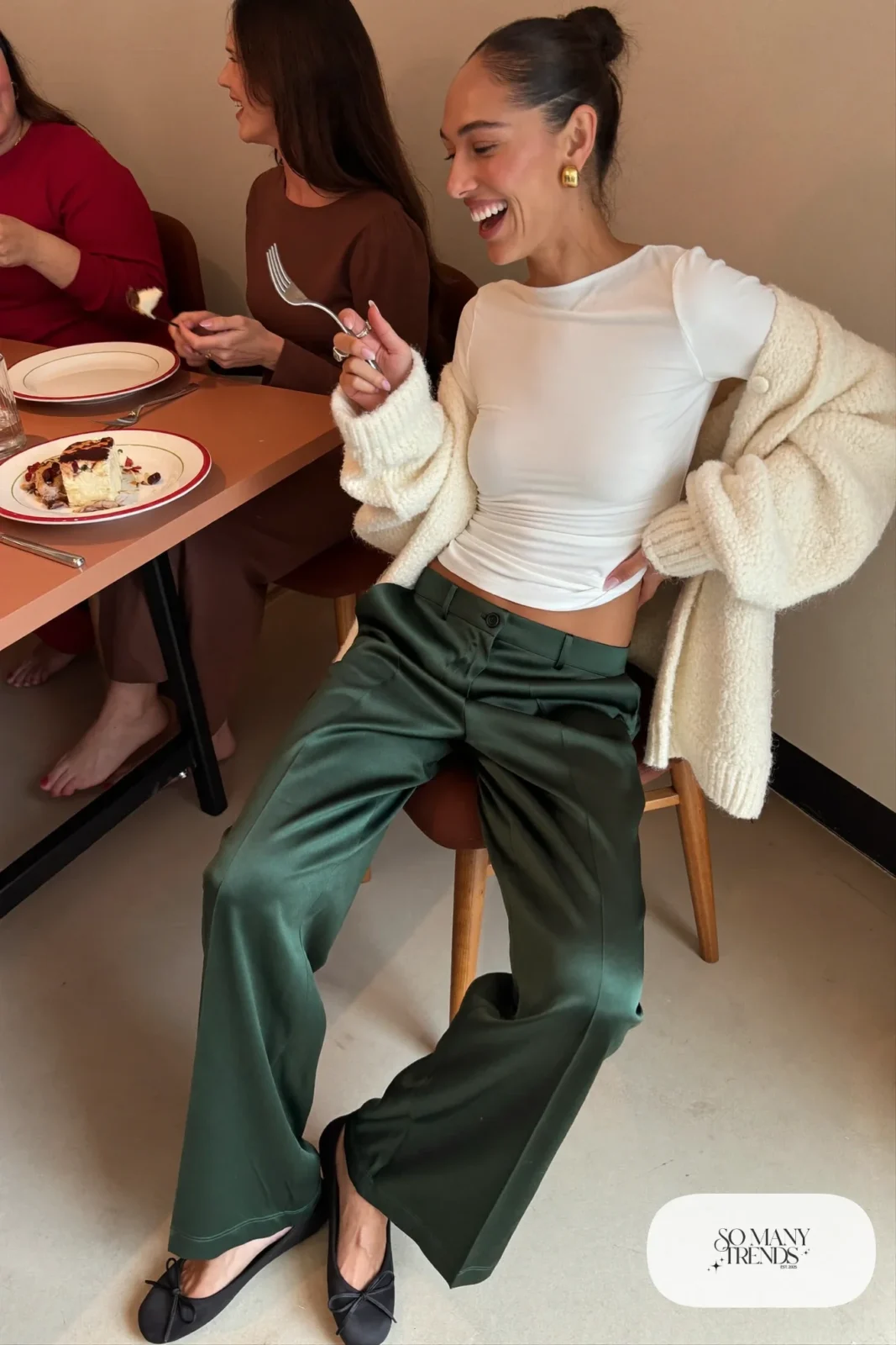 forest green satin wide leg pants cream chunky cardigan white top black ballet flats gold hoops outfit 17