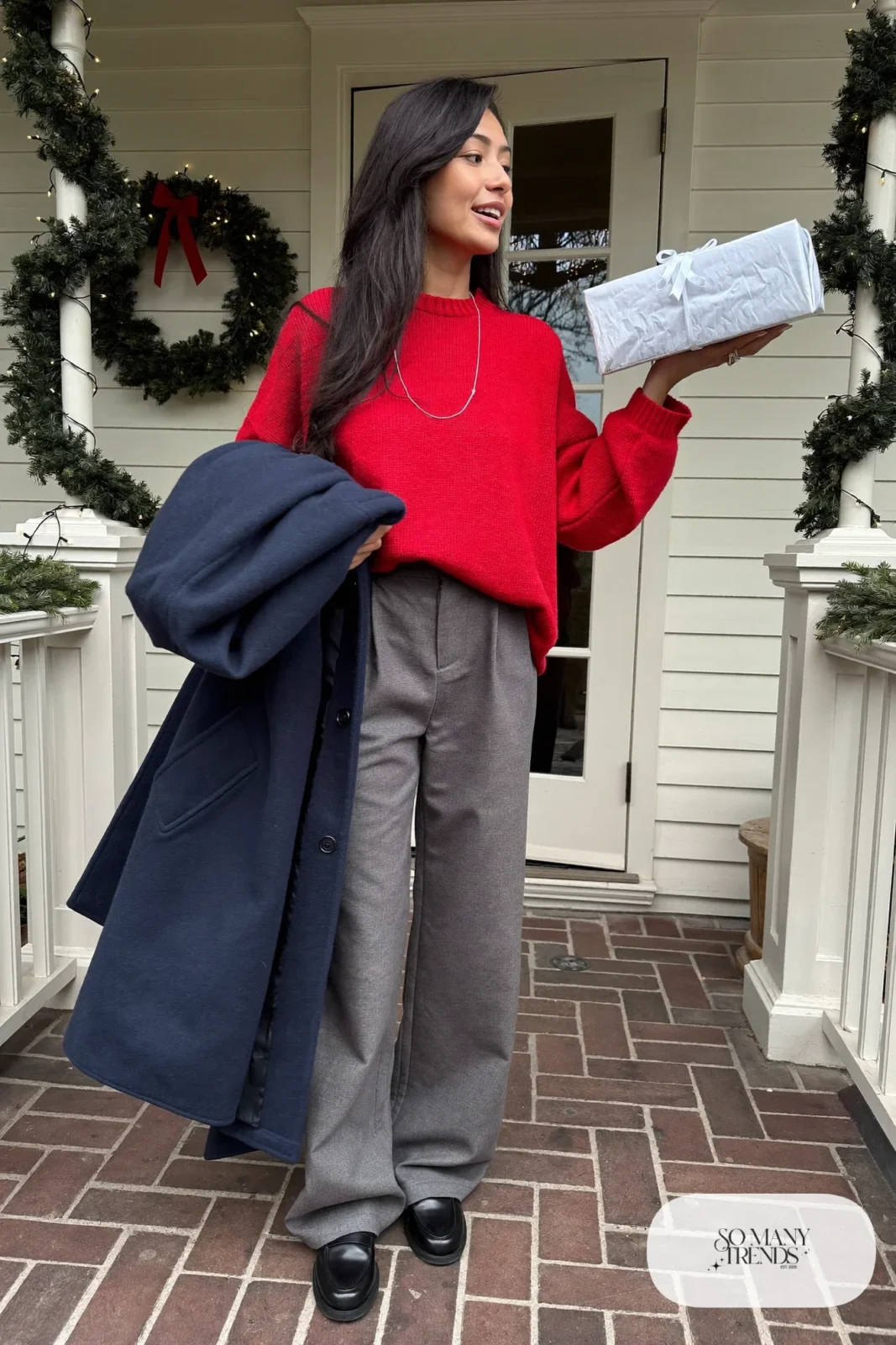 gray wide leg flannel trousers cherry red knit sweater black loafers silver necklace navy coat outfit 18