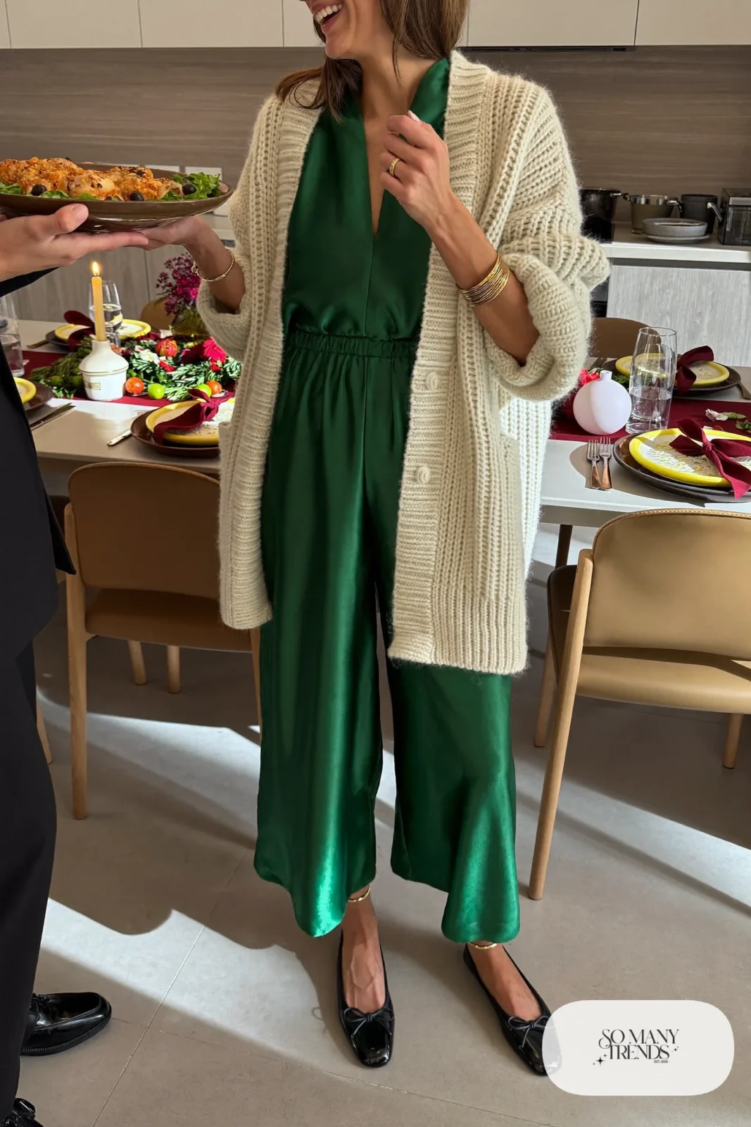 forest green satin wide leg jumpsuit cream chunky cardigan black ballet flats gold bangles outfit 26