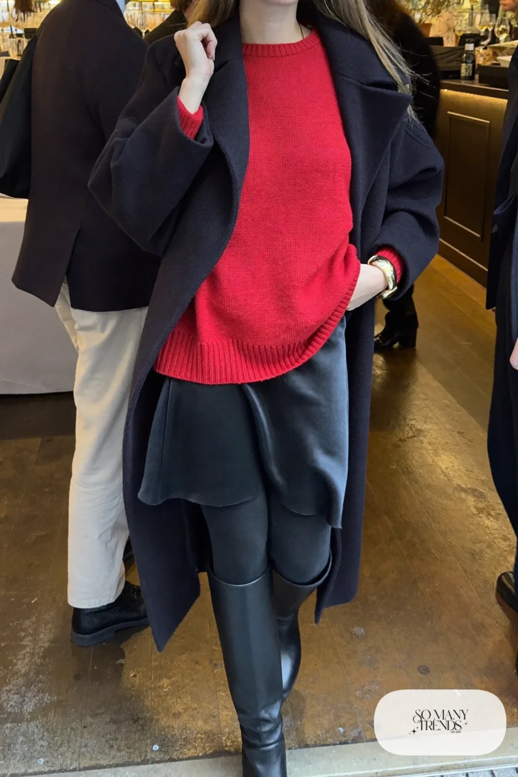 cherry red roomy sweater black satin midi skirt tall black boots wool coat gold bracelet outfit 5