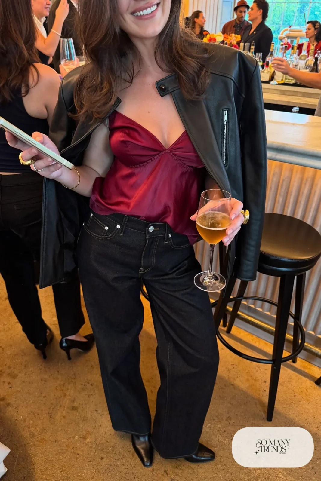 dark wide-leg jeans burgundy silk camisole boxy black leather jacket pointed heeled boots statement ring outfit 19