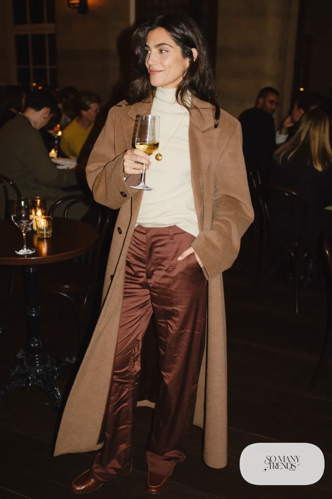 chocolate brown satin wide-leg pants cream turtleneck sweater brown leather loafers long camel coat outfit 21