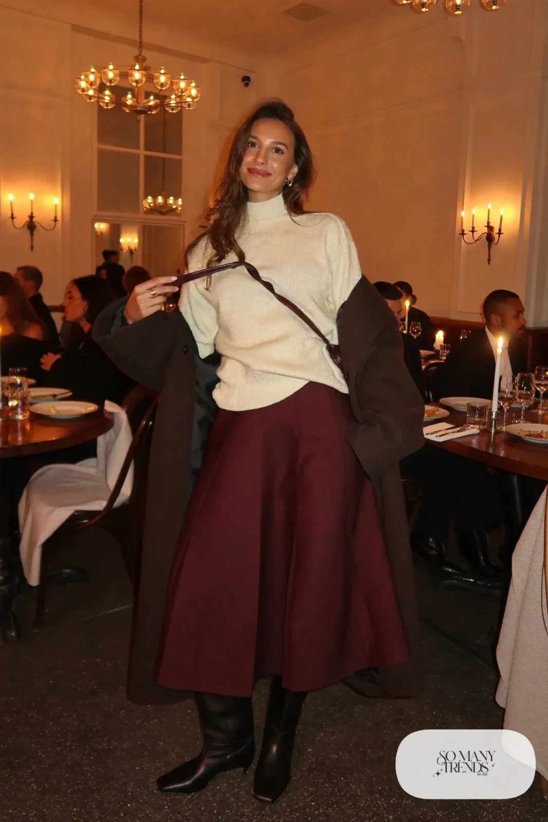 pleated burgundy midi skirt cream sweater tall black boots long dark coat outfit 26