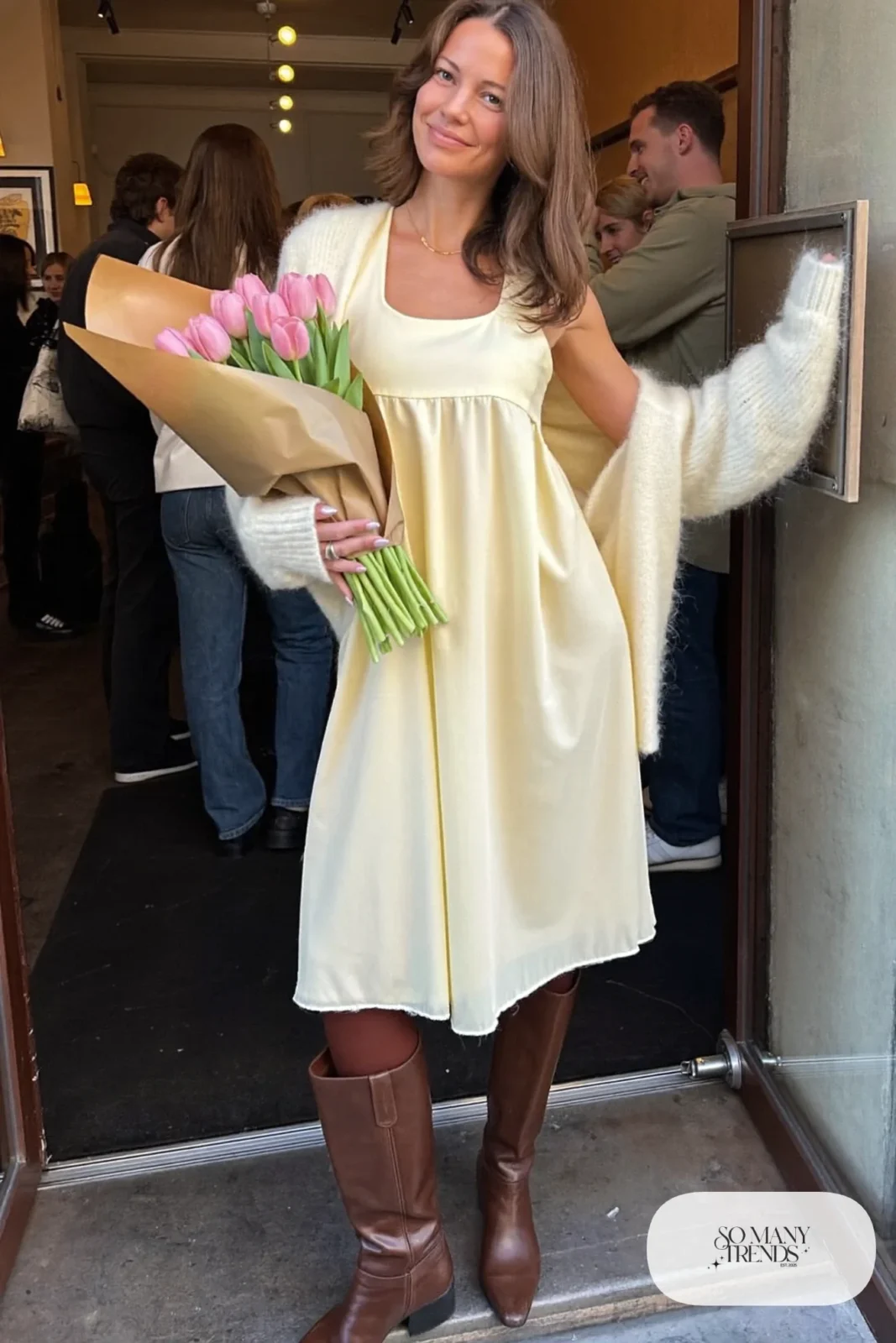 butter yellow midi dress cream chunky cardigan brown opaque tights tall brown leather boots galentines brunch outfit 4