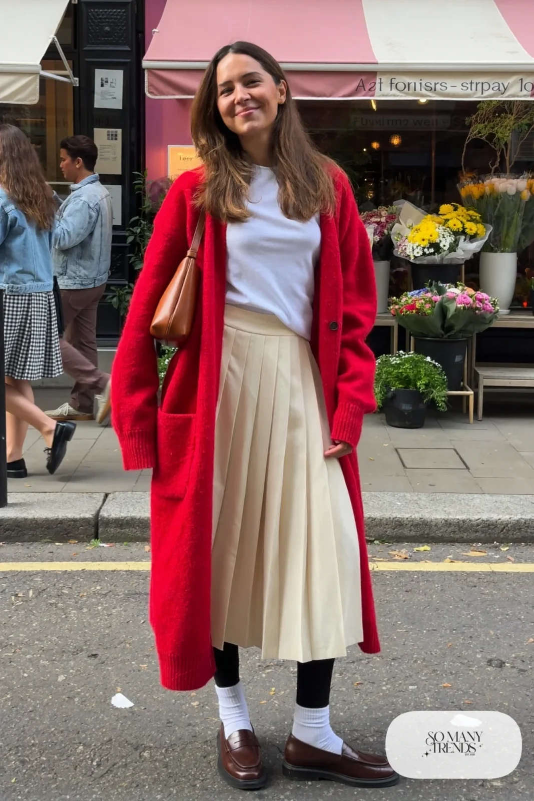 cherry red oversized cardigan cream pleated midi skirt white tee brown loafers crew socks brown shoulder bag galentines outfit 8