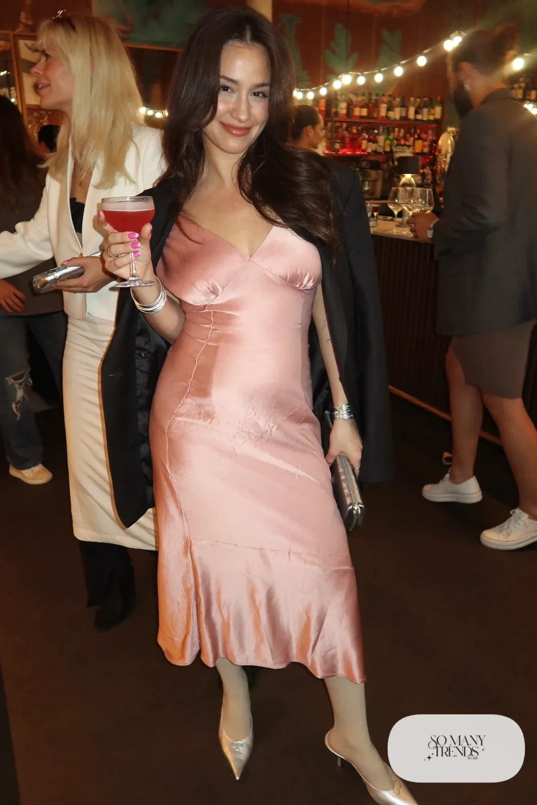 pink satin bias-cut midi dress oversized black blazer sheer tights silver closed-toe pumps small silver clutch galentines cocktail outfit 11