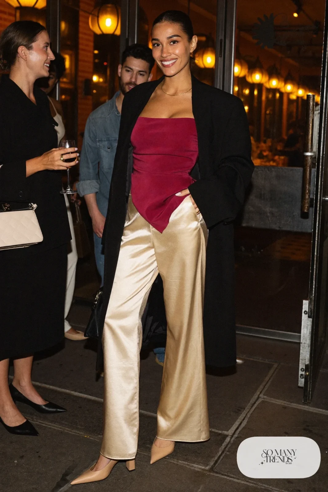 burgundy wrap top champagne satin wide-leg pants long black coat nude block heel pumps gold necklace structured bag galentines dinner outfit 18