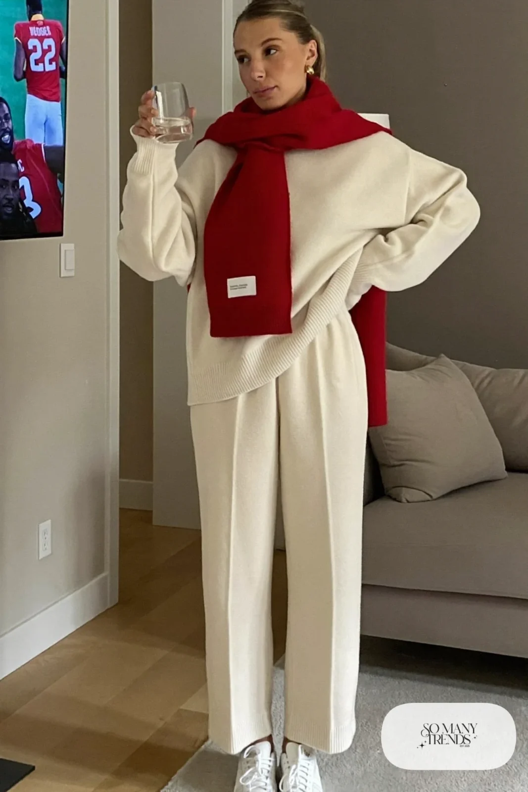 cream knit sweater and wide-leg pants set red scarf white sneakers outfit 11