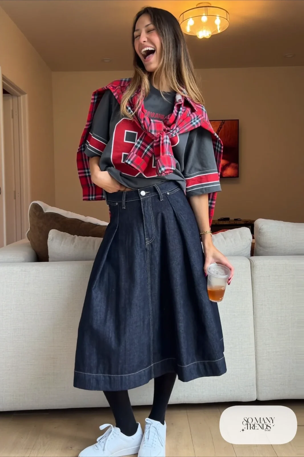 dark denim midi skirt gray football tee tied flannel black tights white sneakers outfit 13