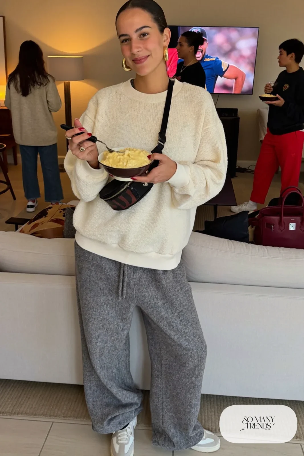 gray wide-leg knit joggers cream sweatshirt black belt bag white sneakers outfit 19