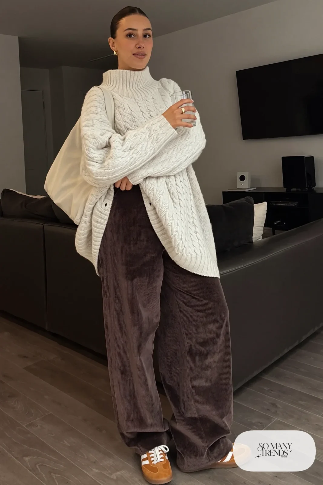 chocolate brown corduroy wide-leg pants cream cable knit sweater leather sneakers canvas tote outfit 22