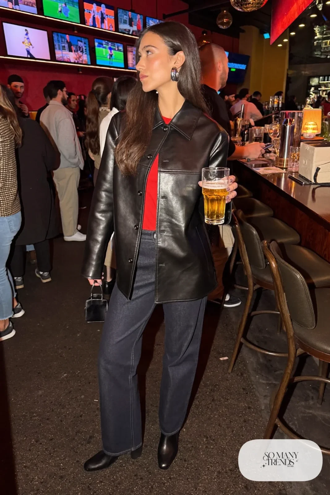 black faux leather jacket red tee dark straight jeans black ankle boots silver hoops outfit 23