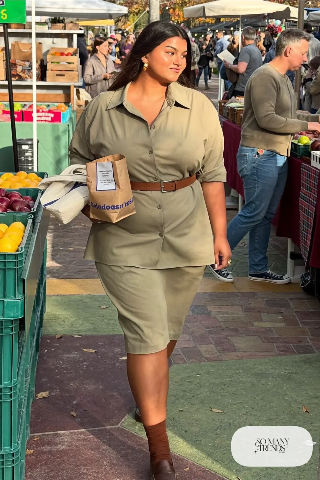 Woman in an oatmeal belted shirtdress with open collar and espresso loafers, outfit 2