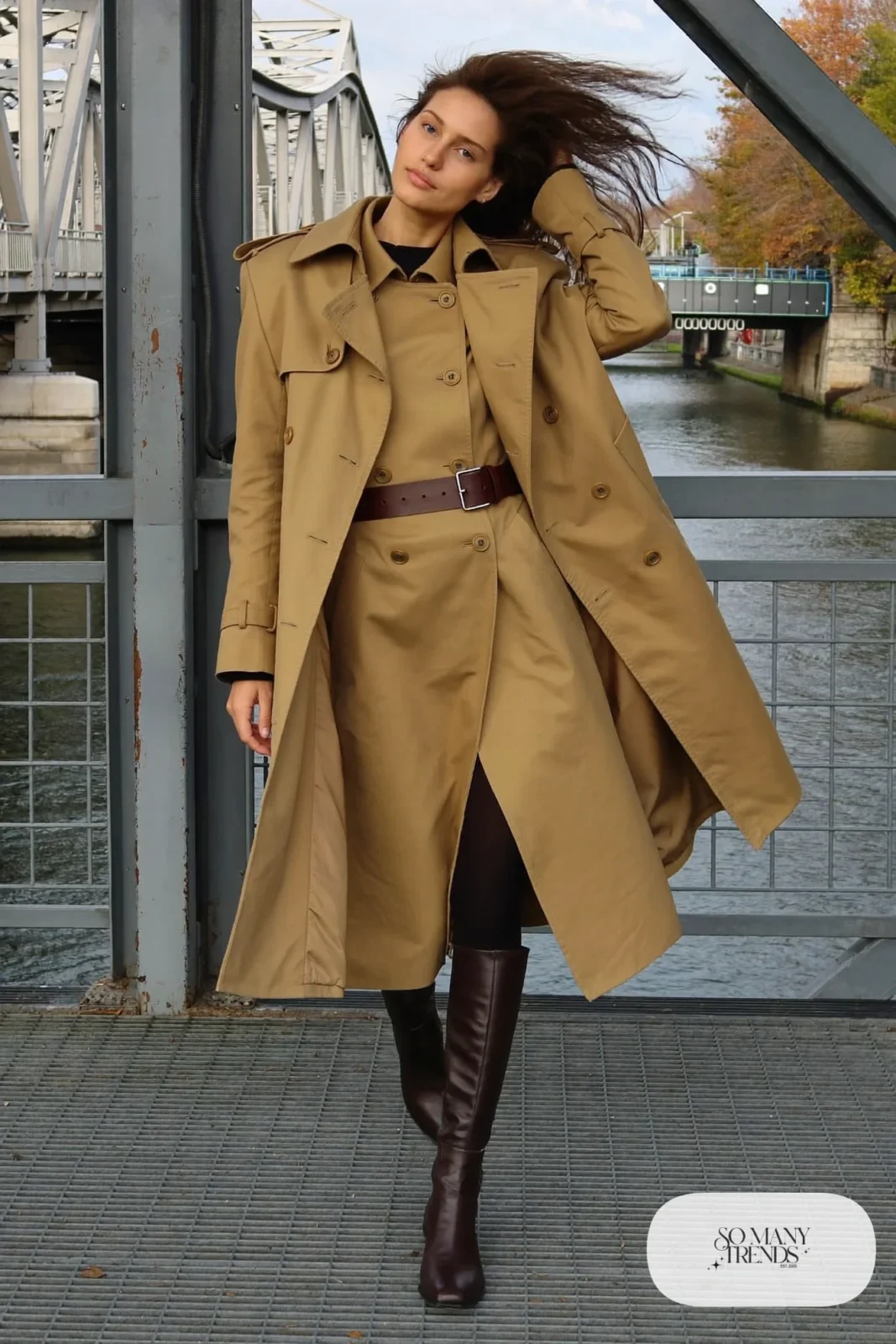Woman with a straight athletic figure in a sand trench dress with a contrast brown belt and tall boots, outfit 24