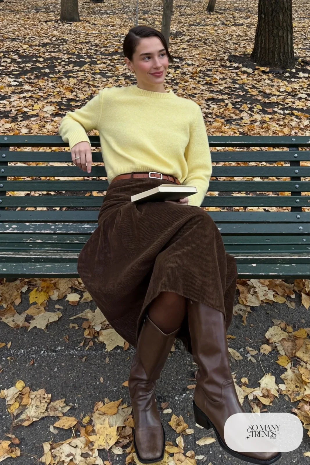 Woman with pear-shaped figure in a butter-yellow sweater, brown A-line corduroy skirt and brown boots, outfit 9