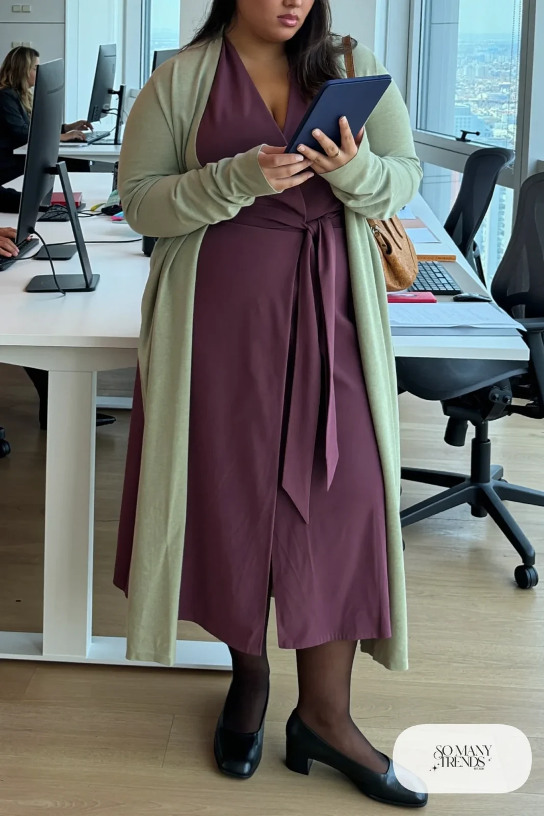 Woman in plum ponte wrap dress, oatmeal long cardigan, black tights and low block-heel pumps, outfit 2