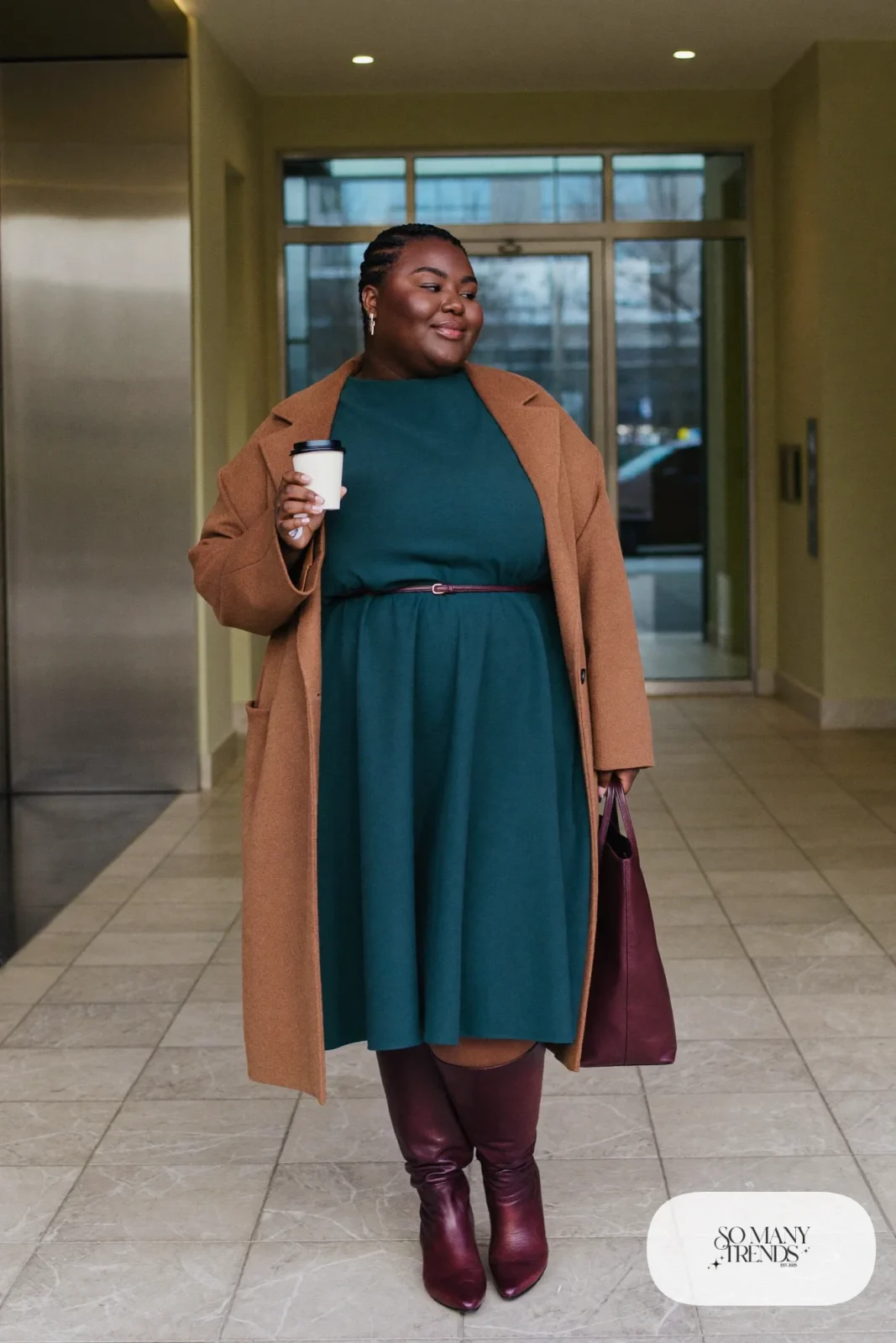 Woman in teal ponte midi dress, camel wool-blend coat and brown knee-high boots, outfit 4