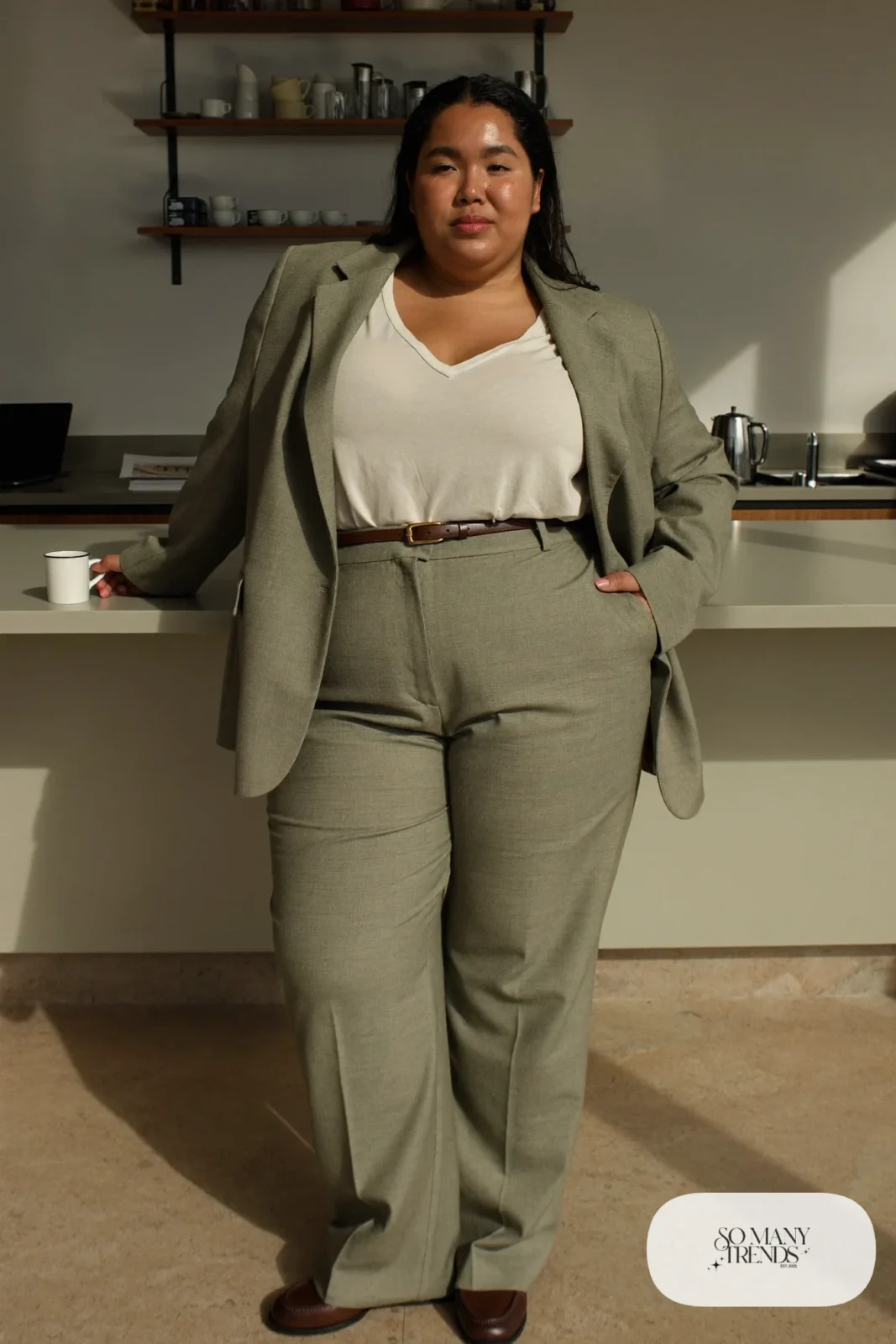 Woman in oatmeal wool-blend blazer and straight pants, ivory V-neck tee, espresso belt and loafers, outfit 6