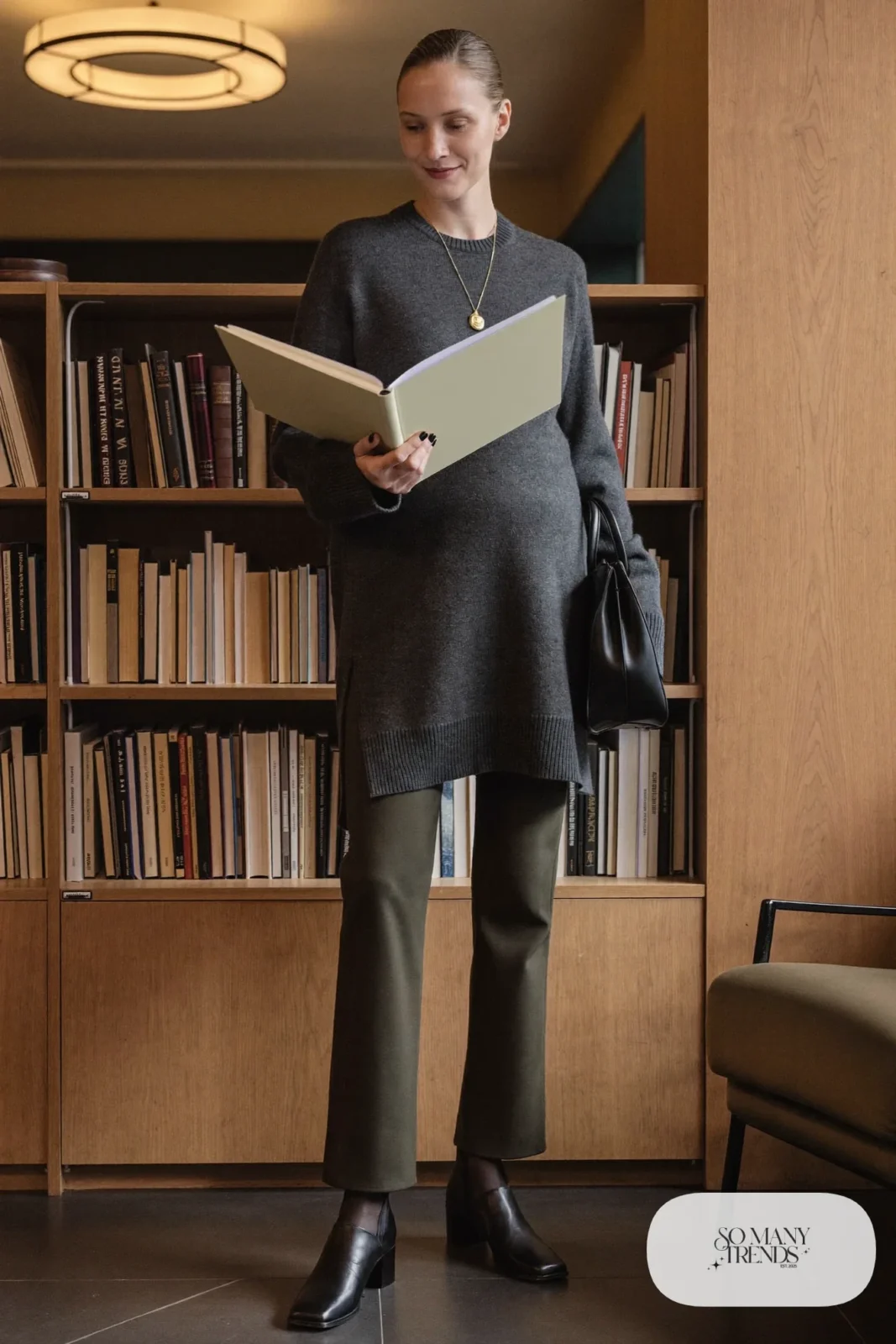 Charcoal tunic sweater with dark olive straight-leg maternity pants and black ankle boots - outfit 14