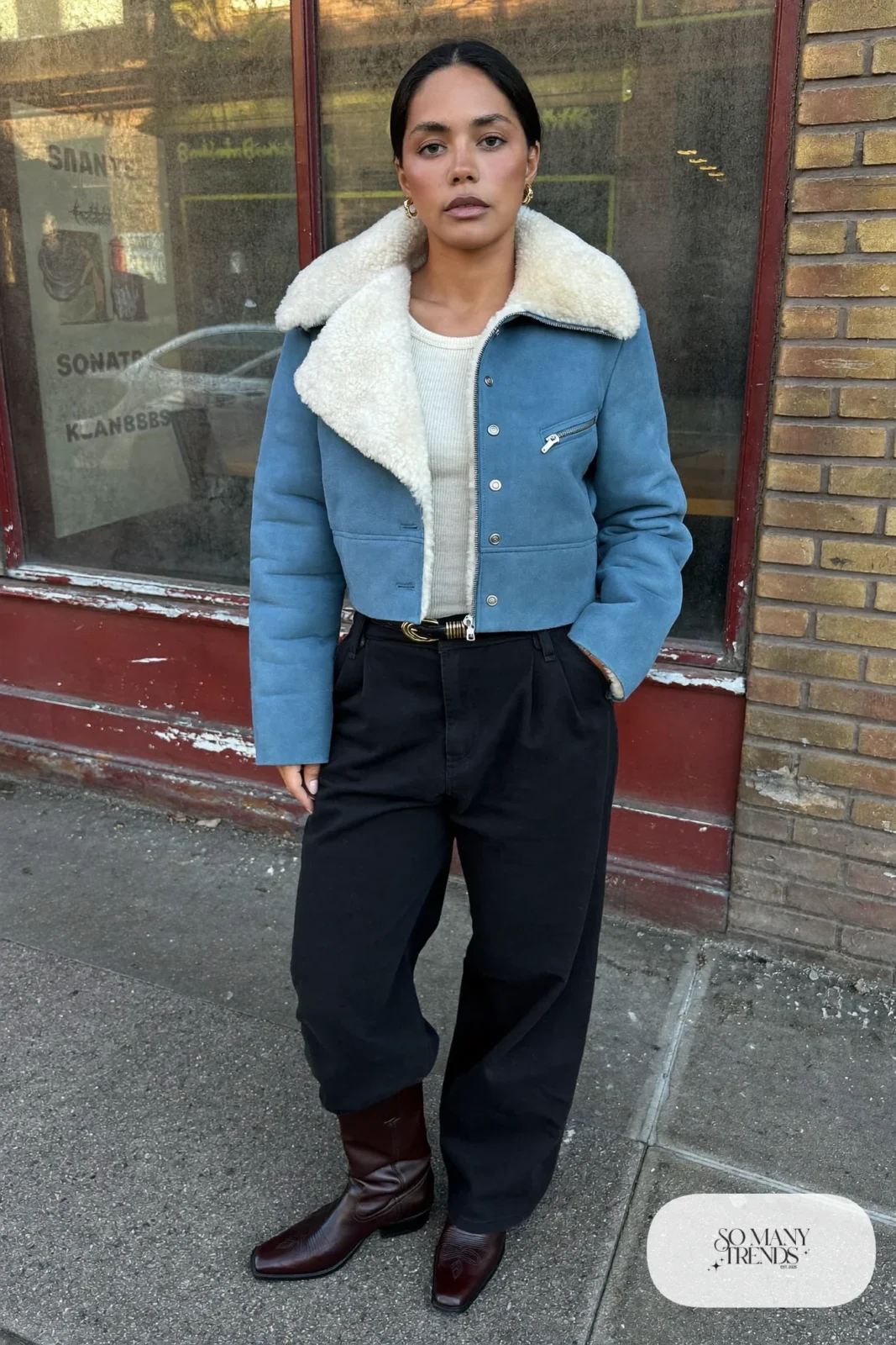 Cropped shearling jacket, cream rib-knit top, high-waisted wide black pants and chocolate brown cowboy boots, outfit 4