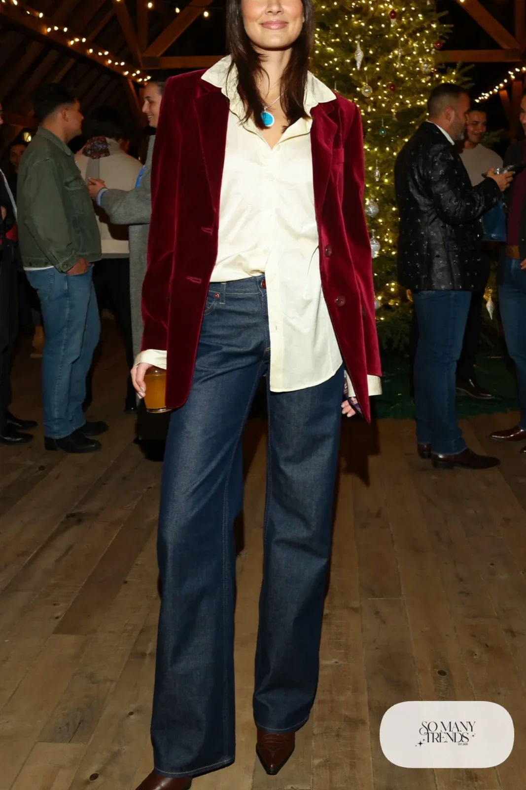 Burgundy velvet blazer over cream silk blouse with dark straight jeans and pointed brown boots, outfit 21