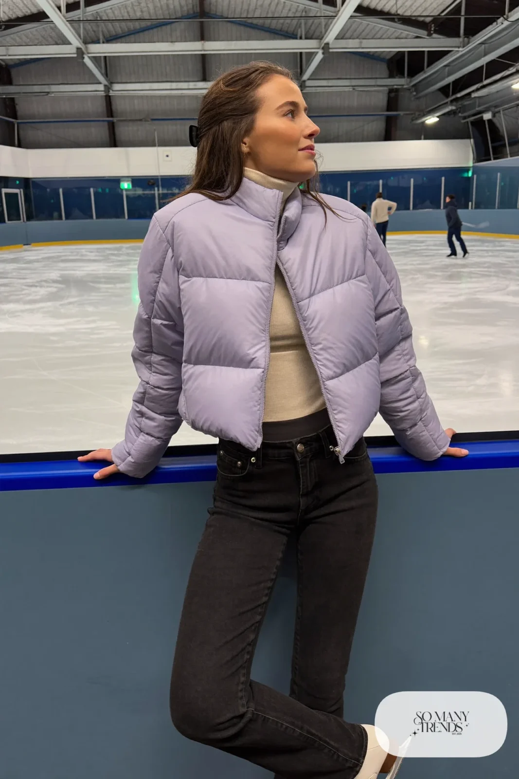 Lilac quilted cropped jacket over cream turtleneck, dark stretch high-waist jeans and ice skates - outfit 6