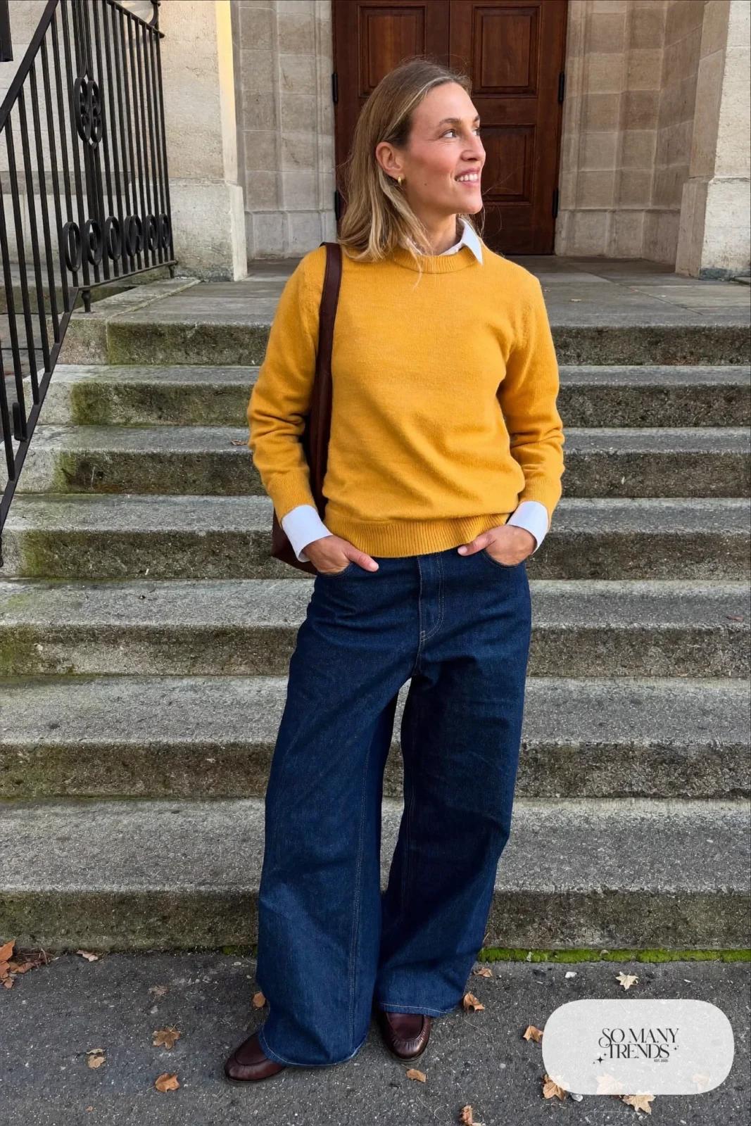 Mustard sweater, white collared shirt, wide dark jeans and brown loafers - outfit 21