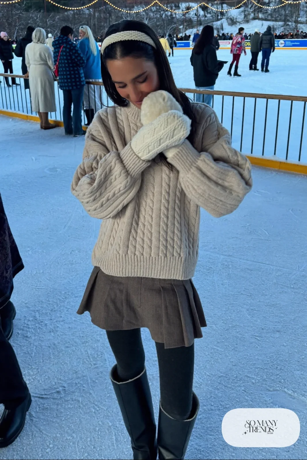 Taupe pleated wool-blend skirt, fleece-lined black tights, chunky champagne knit sweater, tall boots and mittens, winter date outfit 19