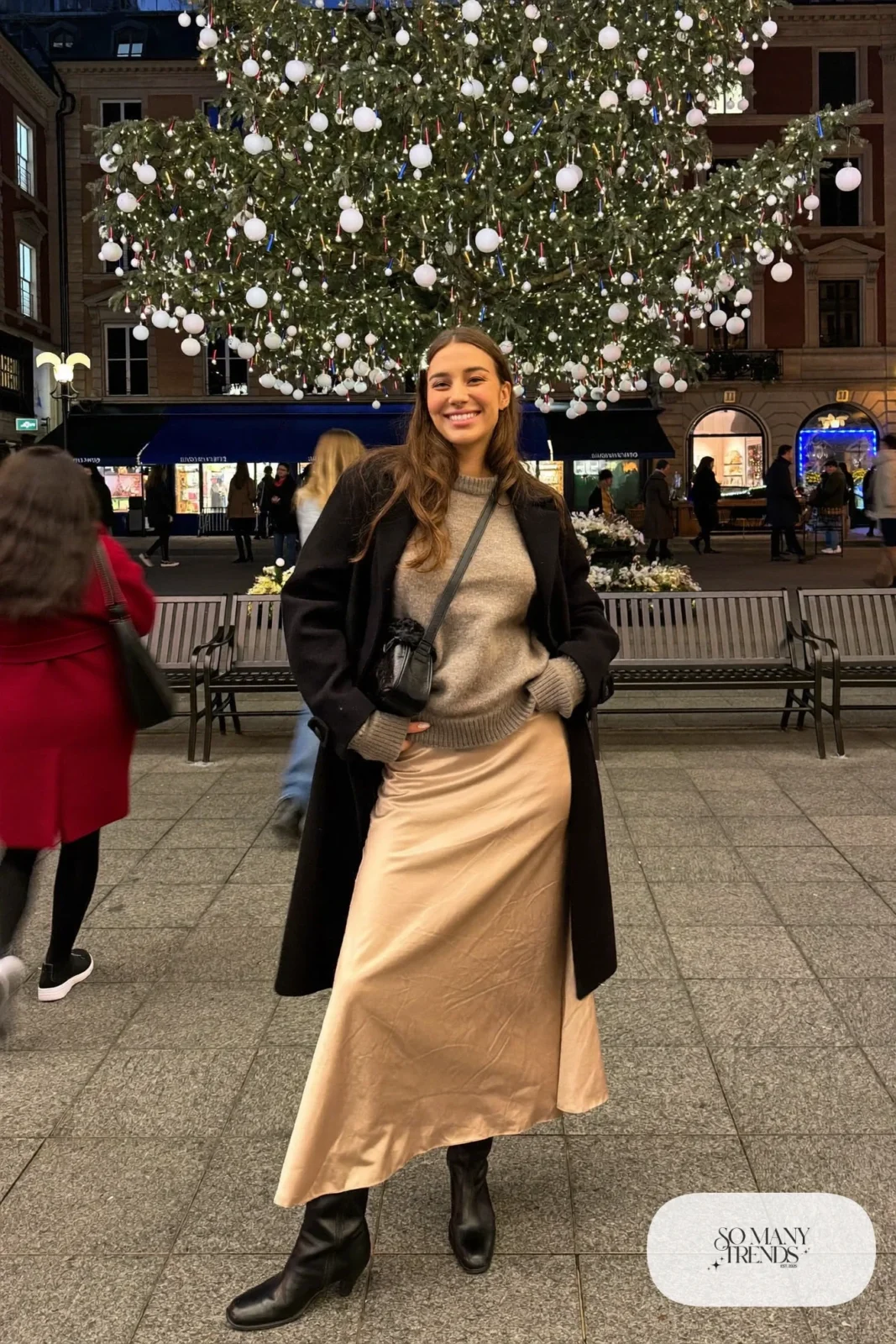 Champagne satin midi skirt, chunky taupe knit sweater, black wool coat, black tights and tall boots, winter date outfit 29