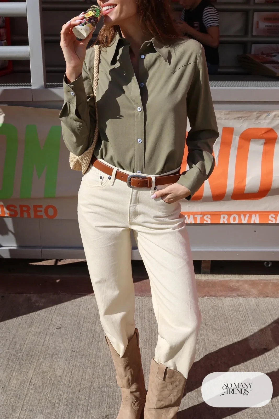 Woman in sage green western shirt, cream jeans and tan boots, outfit 27
