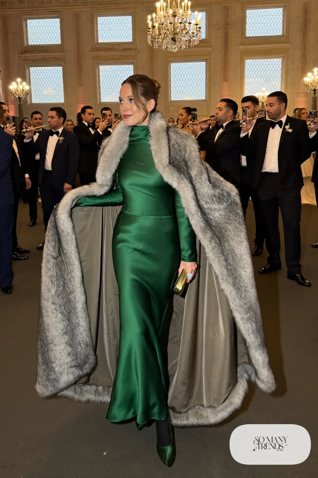 emerald satin long-sleeve floor-length gown, gray faux fur cape, closed-toe satin pumps, gold clutch, winter wedding guest outfit 28