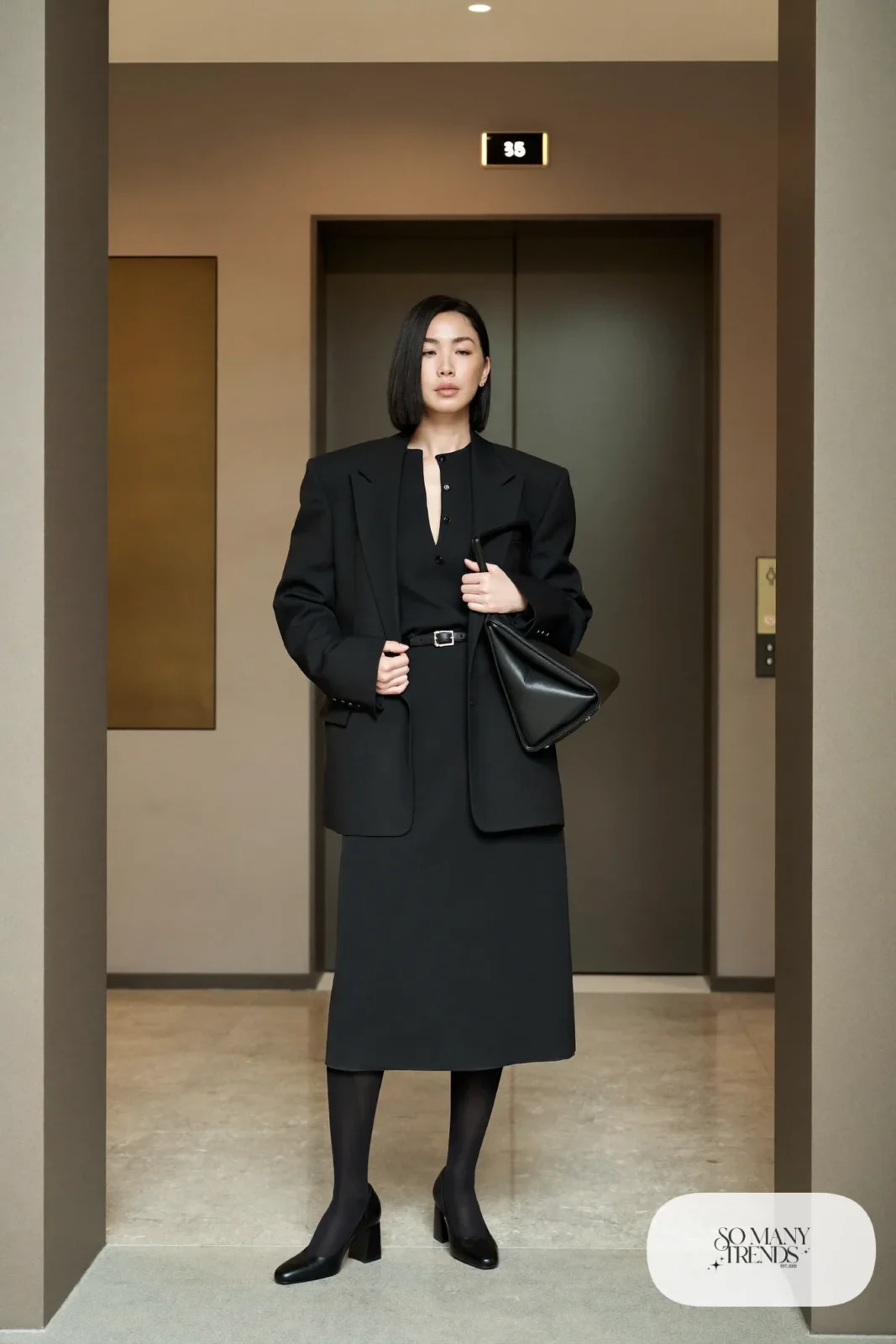 black midi shirt dress with belt, black blazer over shoulders and black block heel pumps, interview outfit 9