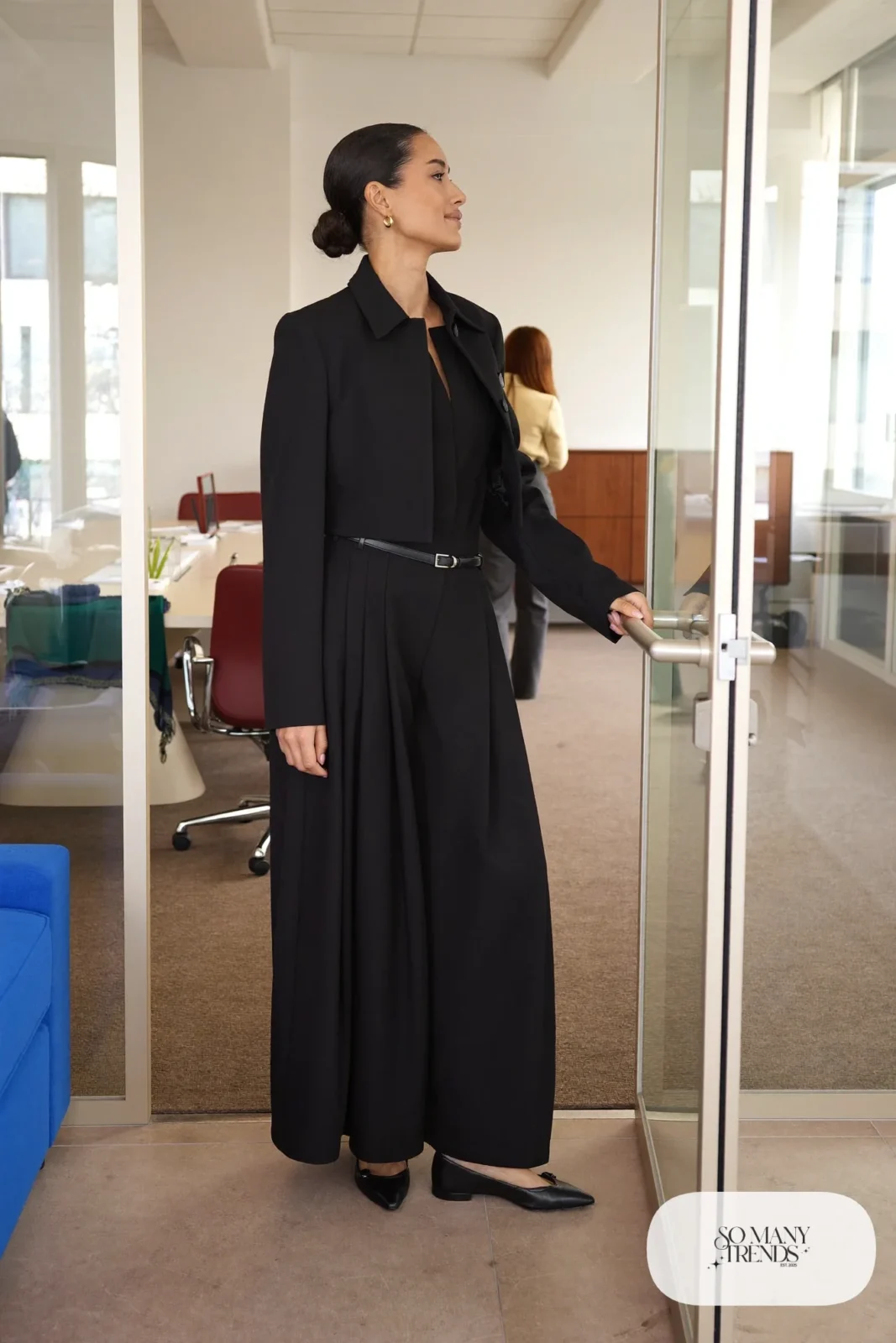 black wide-leg jumpsuit with thin belt and cropped blazer over it with black pointed flats, interview outfit 14