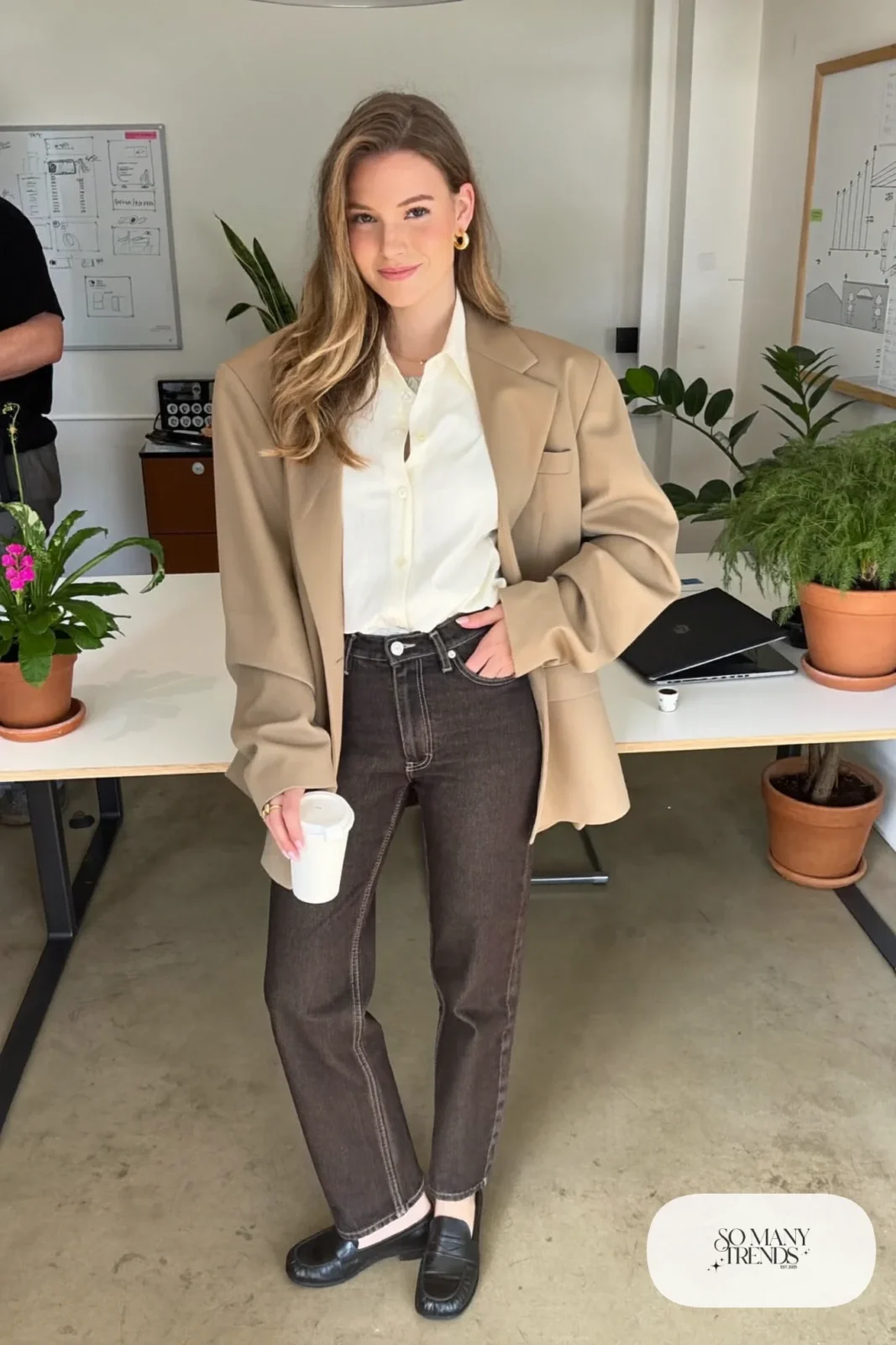 dark wash straight jeans with ivory blouse tucked in, camel blazer and black loafers, interview outfit 16