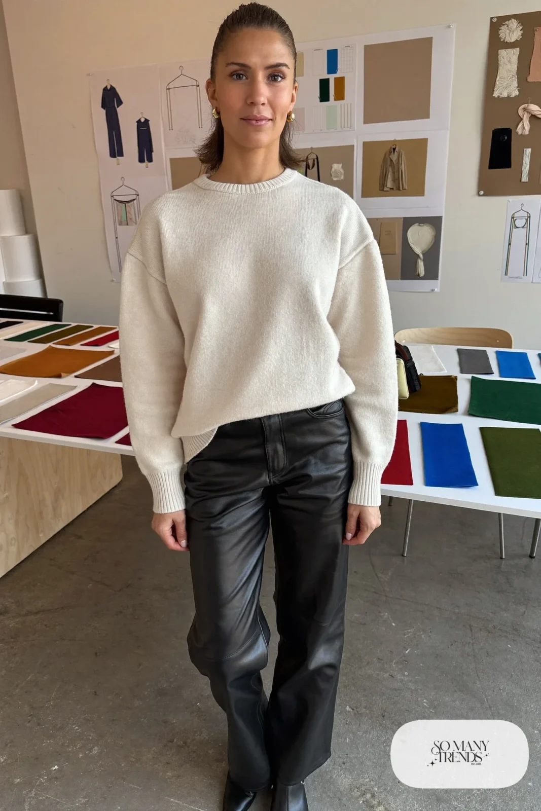 cream chunky knit sweater with black faux leather straight pants and black ankle boots, interview outfit 17