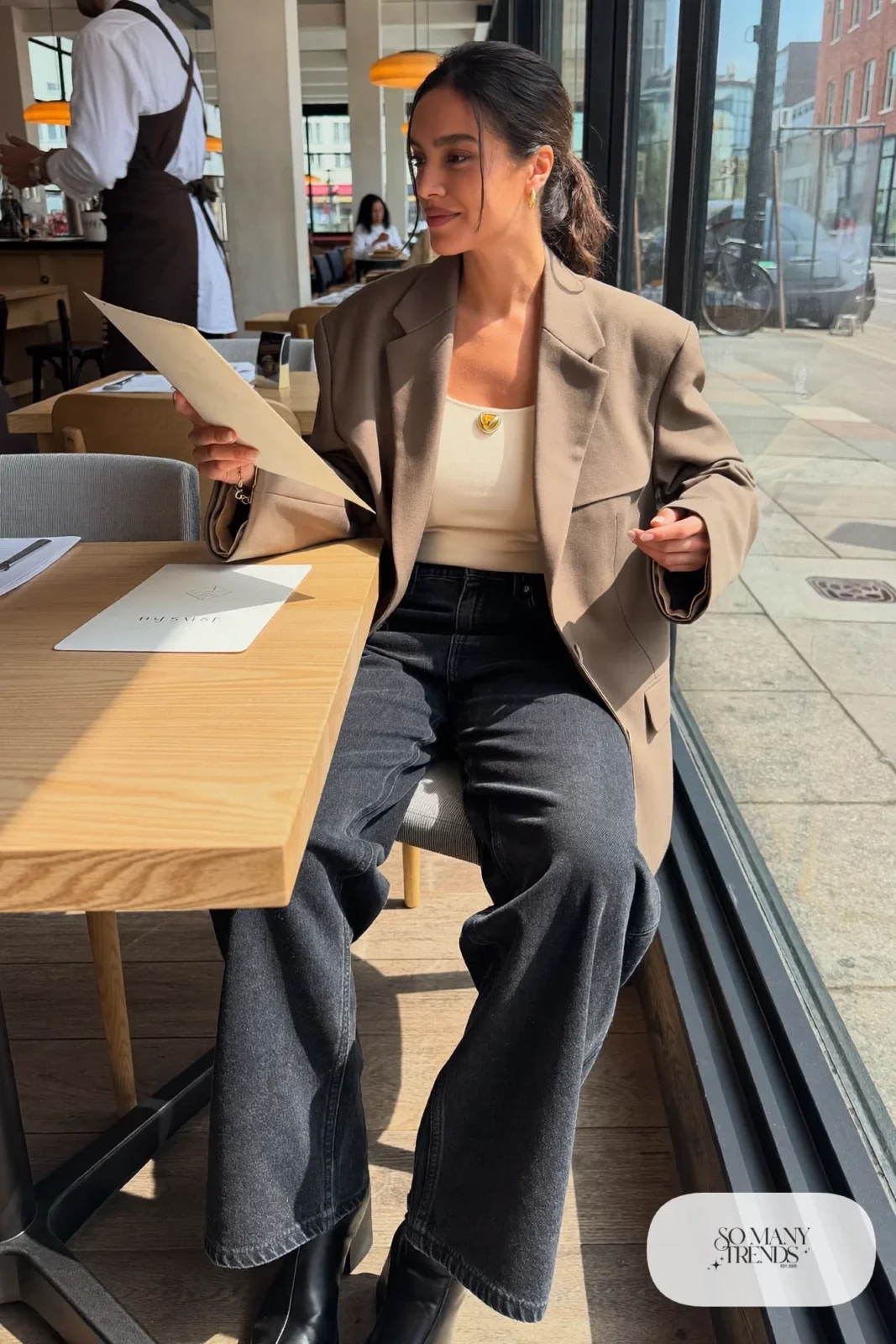 taupe oversized blazer over ivory knit with dark wide-leg jeans and black ankle boots, interview outfit 29