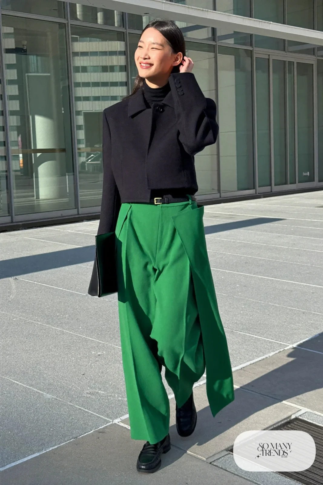 Woman in emerald wide-leg wool pants, black turtleneck, short black wool jacket and black loafers in Tokyo, outfit 19
