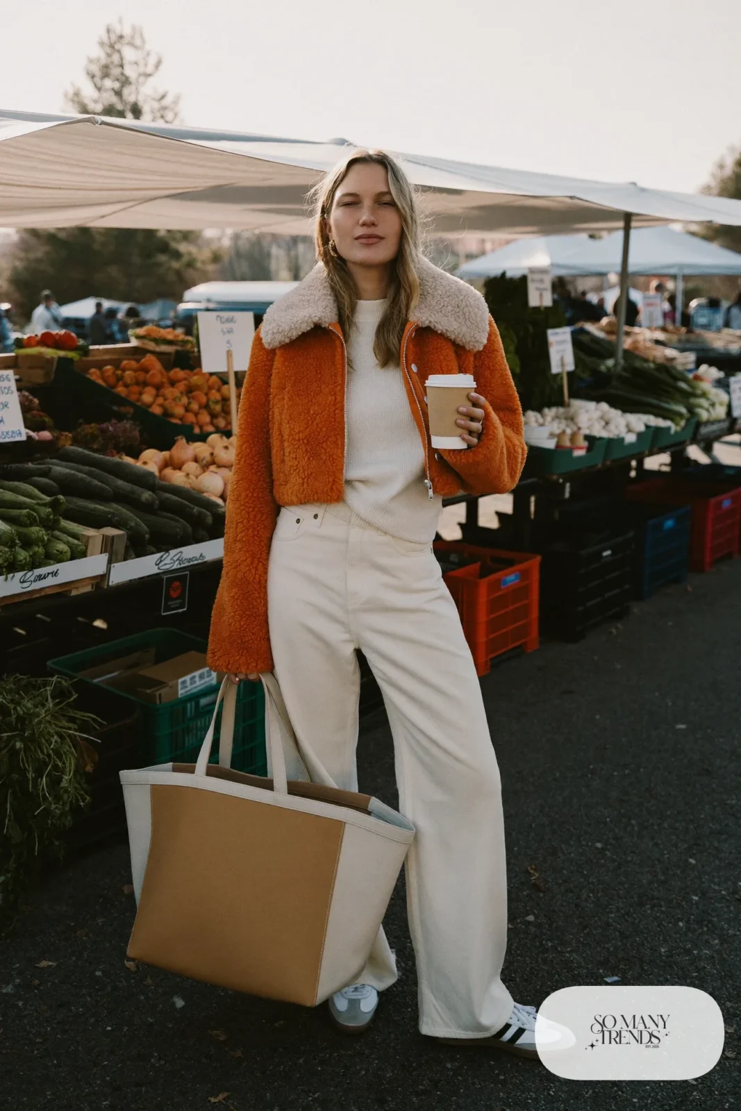 Cropped rust shearling jacket, ribbed cream sweater, high-waist cream wide-leg pants and white Adidas Samba sneakers, outfit 5