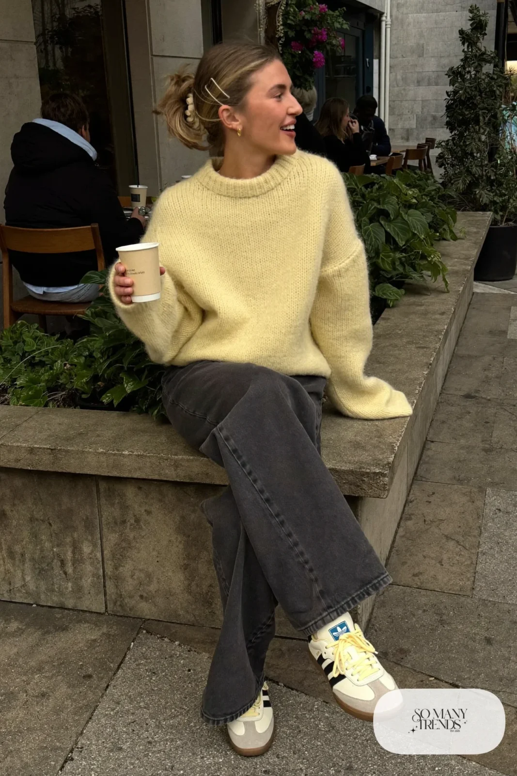 Butter yellow boxy knit sweater, charcoal wide-leg jeans and cream Adidas Samba sneakers with gum sole, outfit 8