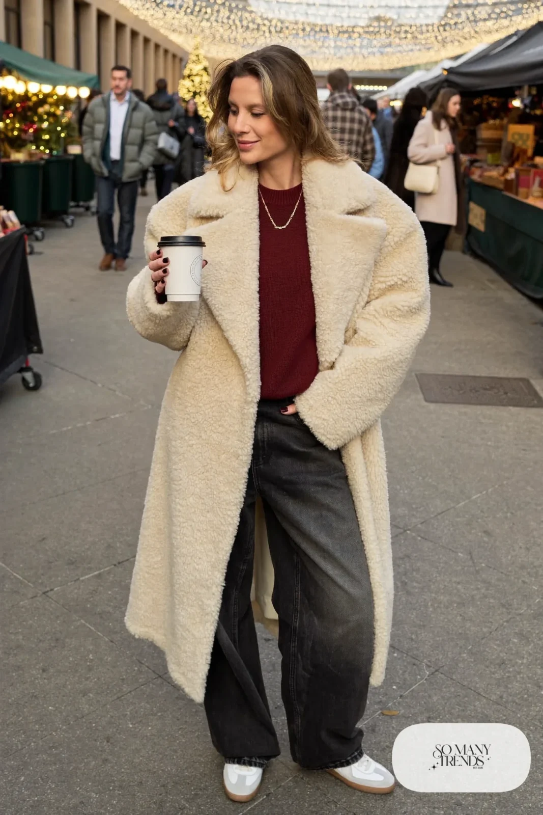 Cream teddy long coat, burgundy sweater, washed-black wide-leg jeans and white Adidas Samba sneakers, outfit 12