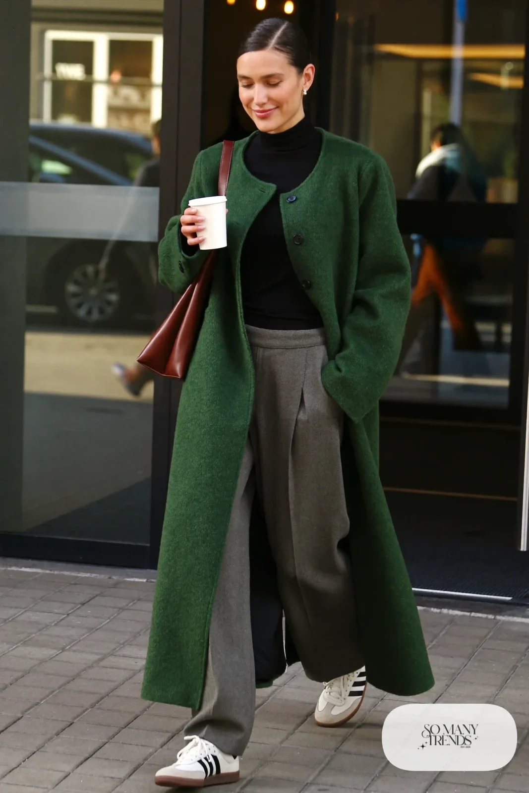 Long forest green wool cardigan coat, black turtleneck, gray wide-leg trousers and cream Adidas Samba sneakers, outfit 14