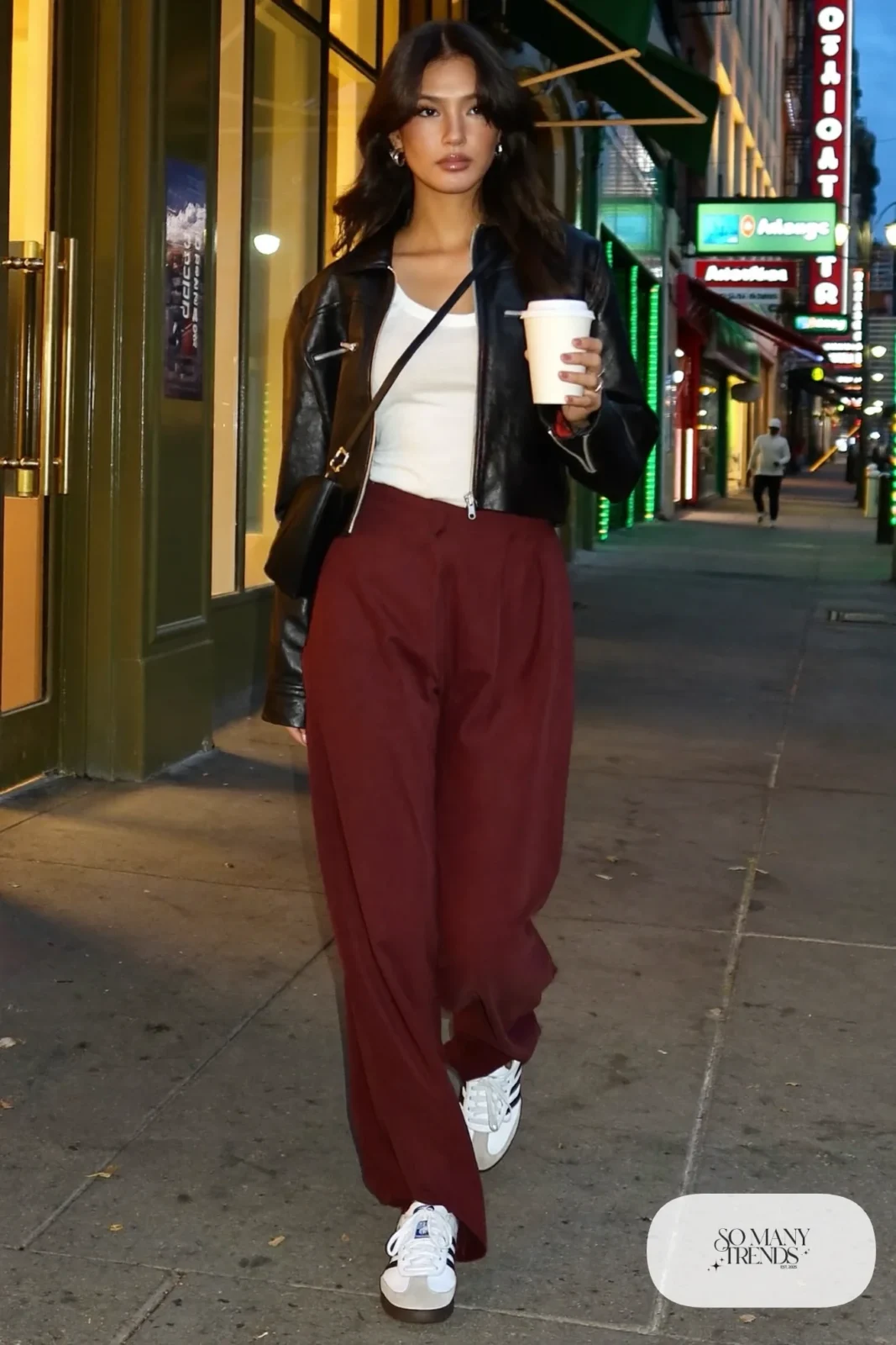 Cropped black leather jacket, white fitted tee, burgundy wide-leg pants and white Adidas Samba sneakers, outfit 18