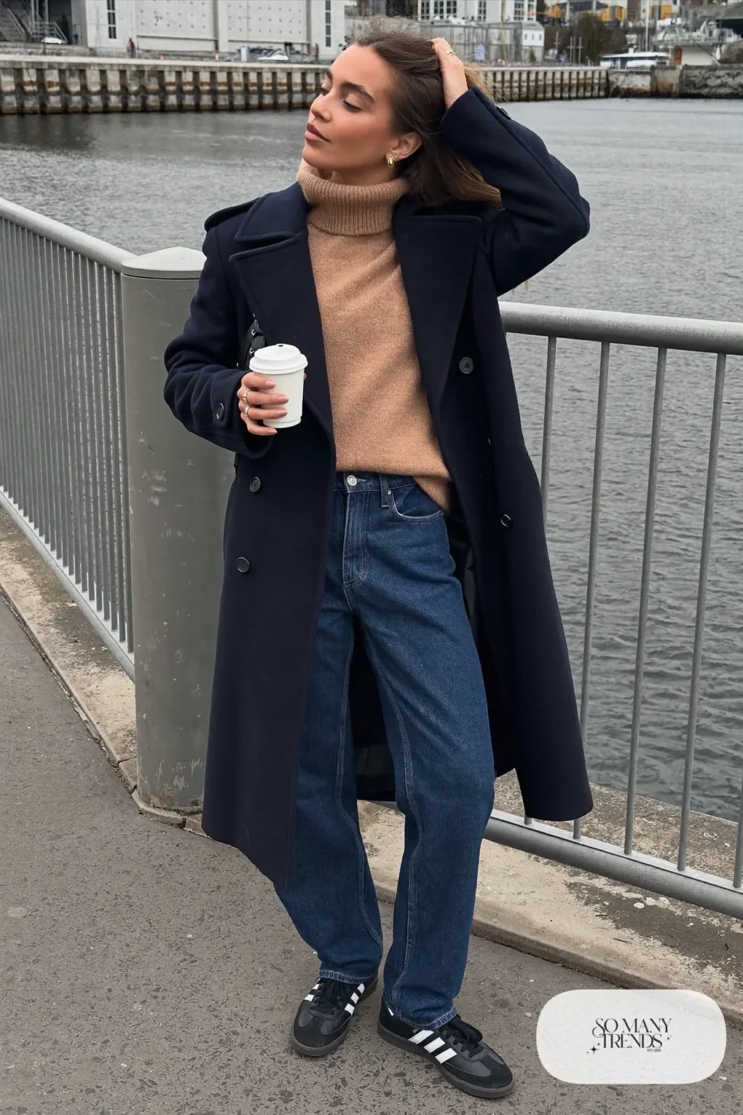 Navy wool peacoat, camel knit sweater, straight dark jeans and black Adidas Samba sneakers, outfit 20