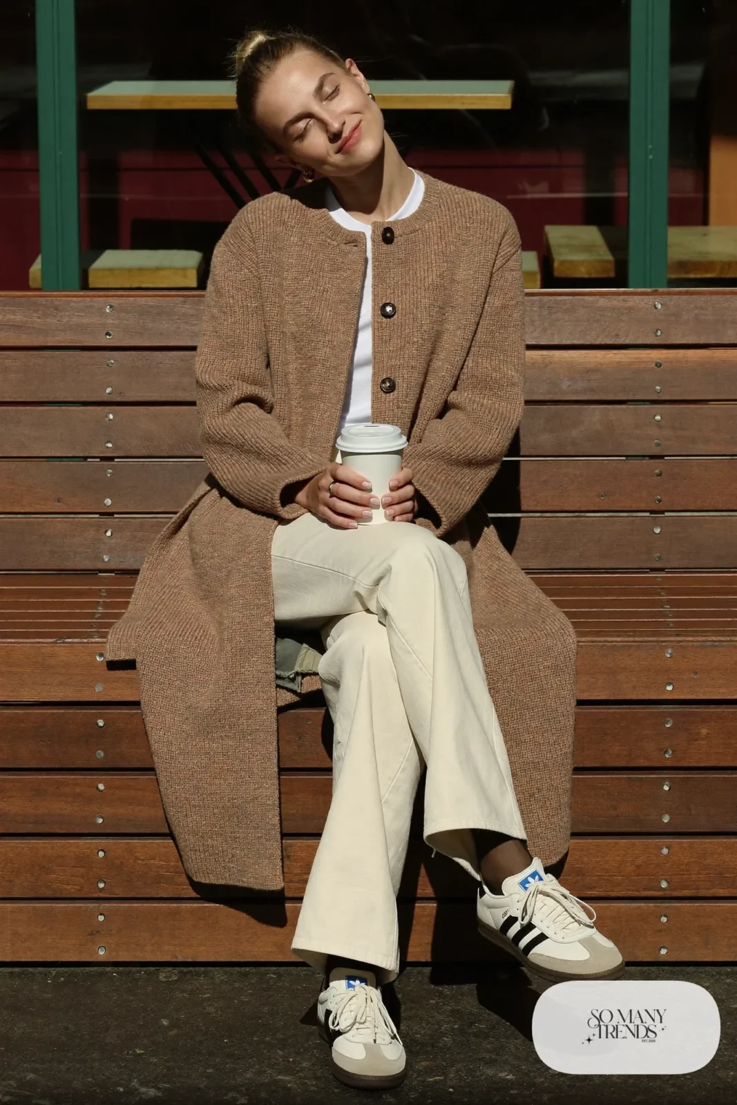 Long camel cardigan, white tee, ecru wide-leg jeans and cream Adidas Samba sneakers with gum sole, outfit 23