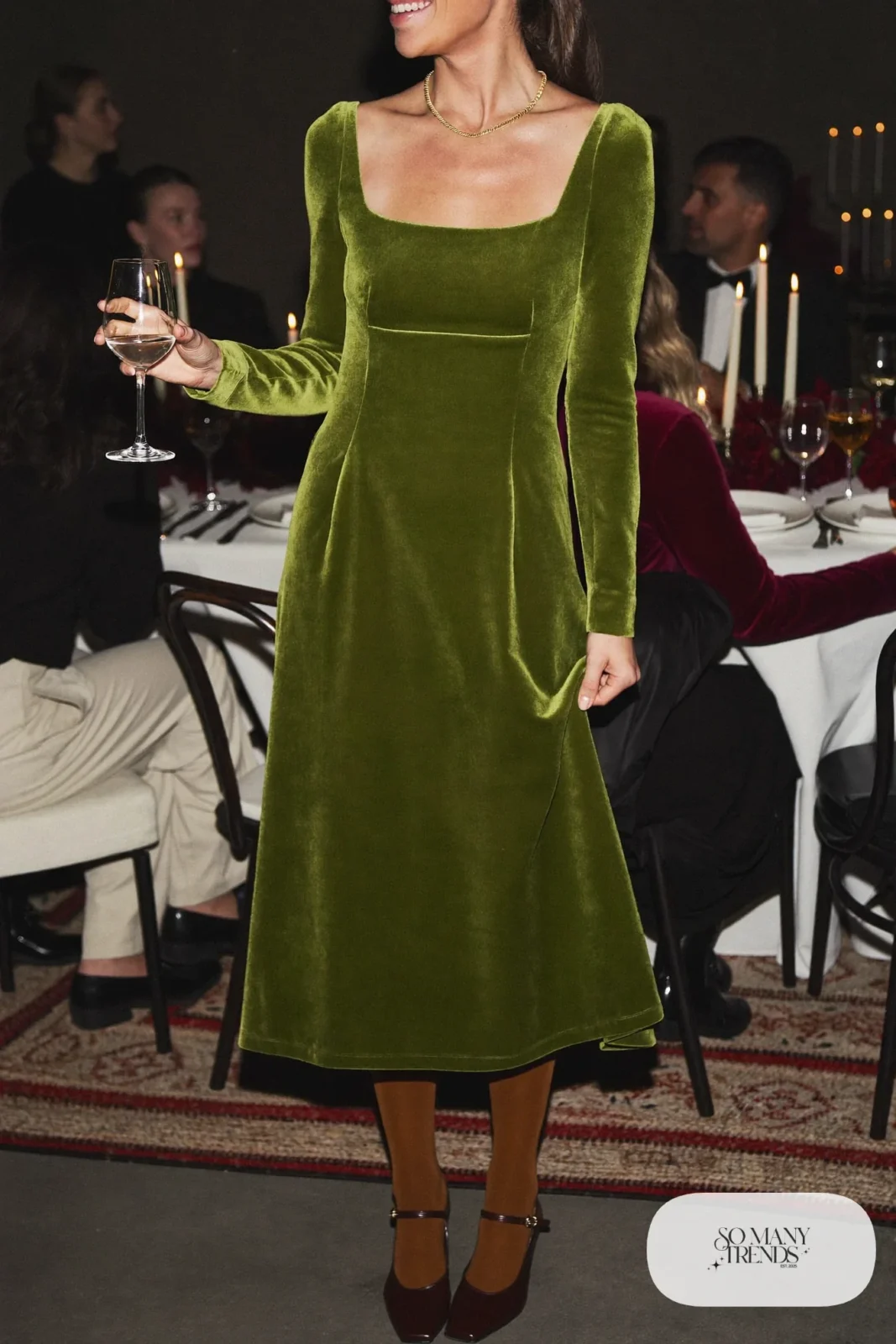 Woman in moss green velvet midi dress, mocha tights and brown mary janes, outfit 6