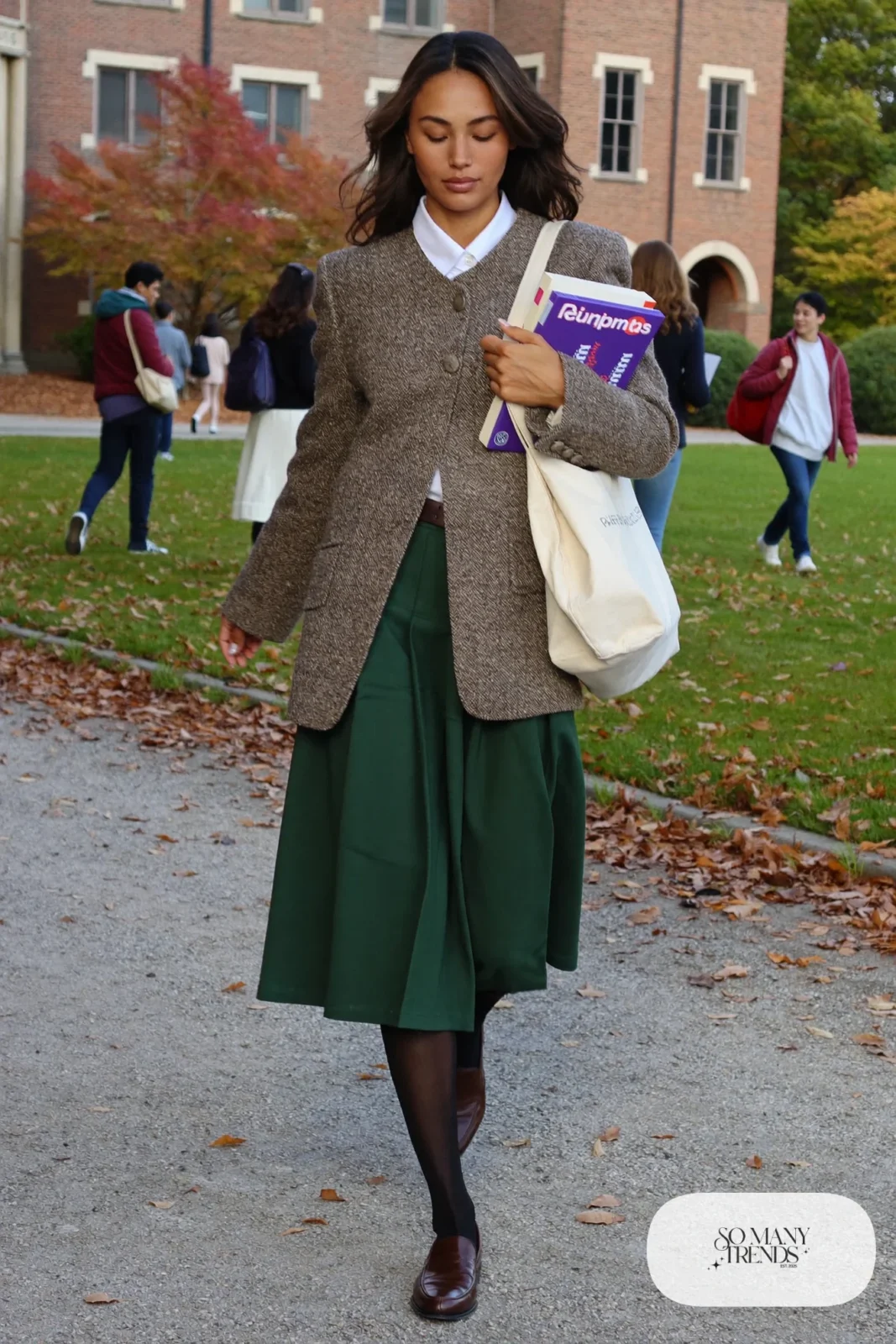 Woman in brown tweed blazer, white collared shirt, green pleated midi skirt and brown loafers, outfit 14